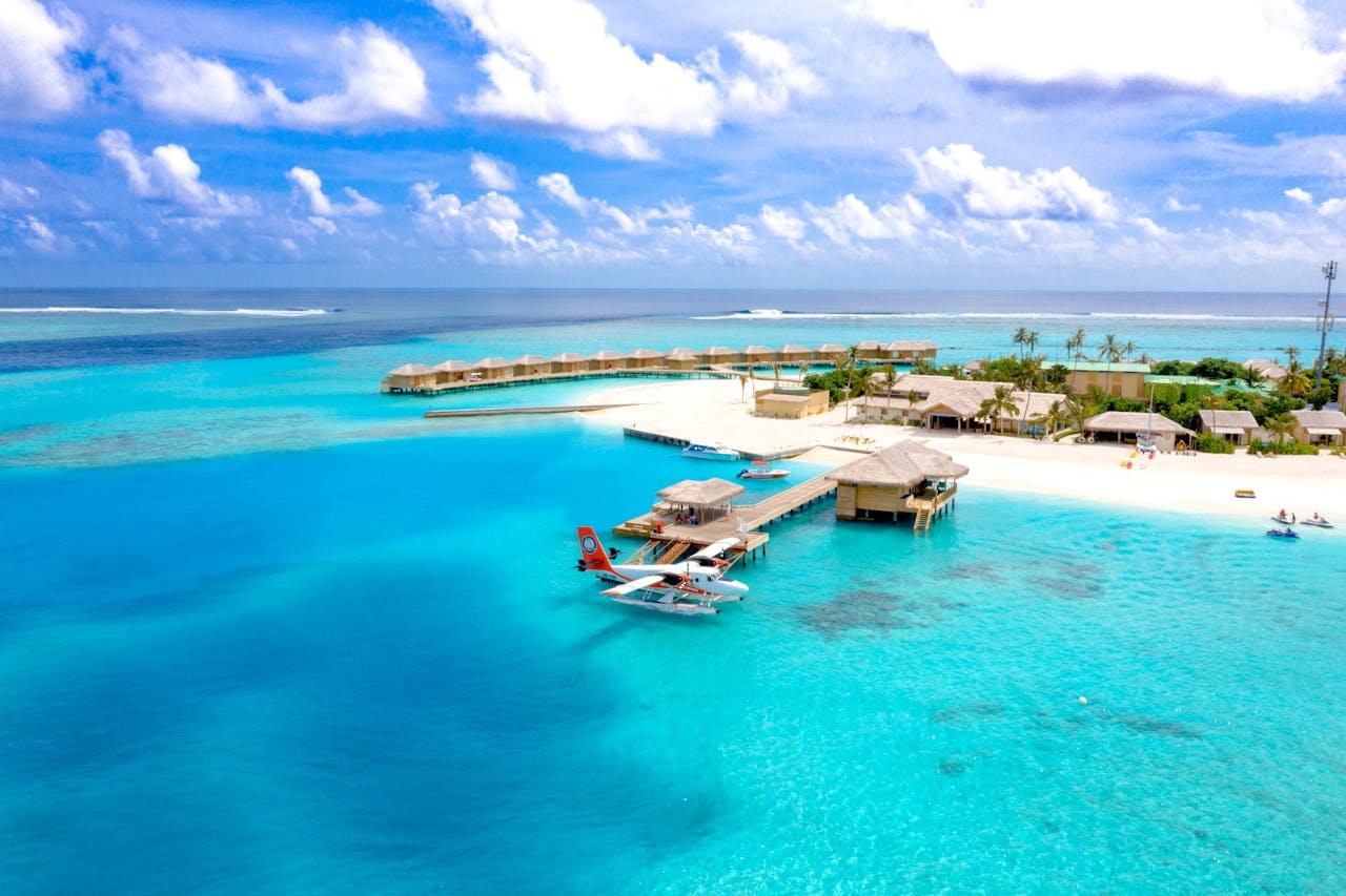 Explore the serene Maldives with turquoise waters and stunning overwater bungalows.